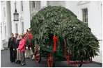 Mrs. Laura Bush welcomes the arrival of the official White House Christmas tree Monday, Nov. 26, 2007, to the North Portico of the White House. The 18-foot Fraser Fir tree, from the Mistletoe Meadows tree farm in Laurel Springs, N.C., will be on display in the Blue Room of the White House for the 2007 Christmas season. Joining Mrs. Bush, from left are, Beth Walterscheidt, president of the National Christmas Tree Association, and Joe Freeman and his wife Linda Jones of Mistletoe Meadow tree farm in Laurel Springs, N.C. 