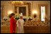 Standing with White House Executive Chef Cristeta Comerford, Laura Bush discusses this year's theme "Holiday in the National Parks" with members of the media Thursday, Nov. 29, 2007, in the State Dining Room. "They're our major and most fabulous and magnificent landscapes, from Yosemite to Denali to the Everglades," said Mrs. Bush.