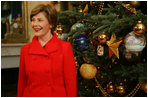 Laura Bush shows off the White House Christmas Tree during a press preview of the holiday decorations Thursday, Nov. 29, 2007, in the Blue Room. Decorated with 347 ornaments honoring the nation's national parks, the tree is an 18-foot Fraser fir presented to Mrs. Bush by Joe Freeman and Linda Jones of Laurel Springs, N.C. White