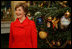 Laura Bush shows off the White House Christmas Tree during a press preview of the holiday decorations Thursday, Nov. 29, 2007, in the Blue Room. Decorated with 347 ornaments honoring the nation's national parks, the tree is an 18-foot Fraser fir presented to Mrs. Bush by Joe Freeman and Linda Jones of Laurel Springs, N.C. White