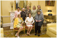 Mrs. Laura Bush is joined by former White House social secretaries Tuesday, Oct. 9, 2007 at the White House, during a tea in honor of Ms. Letitia Baldrige, front-row right, social secretary during the Kennedy administration. Joining Mrs. Bush, from left, are: Mrs. Elizabeth Clements Abell, seated left, social secretary during the Johnson administration; Ms.Maria Downs, social secretary under the Ford administration; Mrs. Lucy Winchester Breathitt, social secretary under the Nixon administration; Mrs. Ann Stock, social secretary during the Clinton administration; Amy Zantzinger, current White House social secretary and Mrs. Cathy Fenton, Mrs. Bush's former social secretary. 
