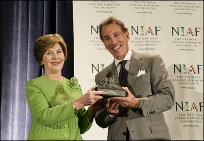 Mrs. Laura Bush is presented with The National Italian American Foundation's Special Achievement Award in Literacy from NIAF Chairman Dr. Ken Ciongoli, Friday, Oct. 12, 2007, in Washington, D.C.