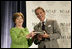 Mrs. Laura Bush is presented with The National Italian American Foundation's Special Achievement Award in Literacy from NIAF Chairman Dr. Ken Ciongoli, Friday, Oct. 12, 2007, in Washington, D.C.