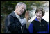 President George W. Bush and Mrs. Laura Bush have a close look at a screech owl Saturday, Oct. 20, 2007 at the Patuxent Research Refuge in Laurel, Md., where President Bush discussed steps his Administration is creating for a series of cooperative conservation steps to preserve and restore critical stopover habitat for migratory birds in the United States.
