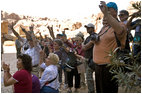 A group of tourists from Texas wave to Mrs. Laura Bush while touring Petra Friday, Oct. 26, 2007, in southern Jordan. Last year more than 300,000 visitors from around the world toured the ancient ruins.