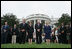 President George W. Bush, Mrs. Laura Bush, Vice President Dick Cheney and Mrs. Lynne Cheney bow their heads for a moment of silence on the South Lawn of the White House Tuesday, Sept. 11, 2007, in memory of those whose lives were lost on Sept. 11, 2001.