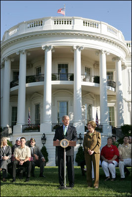 Standing with Mrs. Laura Bush, President George W. Bush addresses military support organizations Tuesday, Sept. 18, 2007, on the South Lawn. "I feel a very strong obligation, since it was my decision that committed young men and women into combat, to make sure our veterans who are coming back from Iraq and Afghanistan get all the help this government can possibly provide," said President Bush.