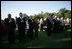 President George W. Bush and Laura Bush stand for the singing of the National Anthem during a visit with military support organizations Tuesday, Sept. 18, 2007, on the South Lawn.