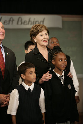 Mrs. Laura Bush stands with students from New York Public School 76 during the President's statement regarding No Child Left Behind Wednesday, Sept. 26, 2007, in New York City.