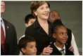 Mrs. Laura Bush stands with students from New York Public School 76 during the President's statement regarding No Child Left Behind Wednesday, Sept. 26, 2007, in New York City.