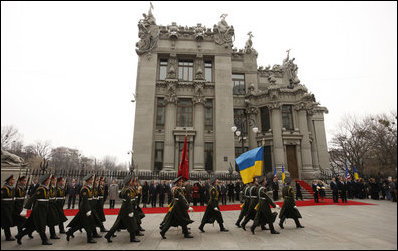 An honor guard marches past the red carpet in front of the Presidential Secretariat in Kyiv Tuesday, April 1, 2008, during arrival ceremonies for President George W. Bush and Mrs. Laura Bush.