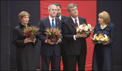 Carrying bowls of corn with candles, President George W. Bush and Mrs. Laura Bush and Ukraine President Viktor Yushchenko and Mrs. Kateryna Yushchenko visit the Holomodor Memorial in Kyiv Tuesday, April 1, 2008. The memorial honors victims of Ukraine's great famine of 1932.