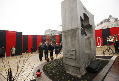 President George W. Bush and Mrs. Laura Bush, accompanied by President Victor Yushchenko and his wife Mrs. Kateryna Yushchenko, pay their respects at the Holodomor Memorial Tuesday, April 1, 2008, in Kyiv, Ukraine. The Holodomor Memorial is a remembrance to the victims 1932-1933 Ukrainian famine.