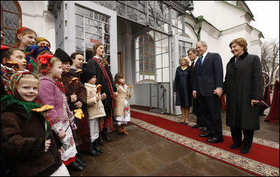 President George W. Bush and Mrs. Laura Bush joined by Ukrainian President Viktor Yushchenko and his wife, first lady Kateryna Yushchenko, are greeted by children, April 1, 2008, before touring St. Sophia's Cathedral in Kyiv, Ukraine.