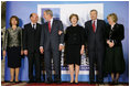 President George W. Bush and Mrs. Laura Bush share a light moment Wednesday, April 2, 2008, with Romania's President Taian Basescu and Mrs. Maria Basescu, left, and NATO Secretary General Jaap de Hoop Scheffer and Mrs. Jeannine de Hoop Scheffer during the NATO Summit official greeting at the Cotroceni Palace in Bucharest.