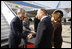 President George W. Bush and Mrs. Laura Bush are greeted upon arrival Wednesday, April 2, 2008, by President Traian Basescu of Romania and Mrs. Maria Basescu at Mihail Kogalniceanu Airport in Constanta, Romania.