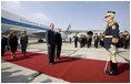 President George W. Bush stands with President Traian Basescu of Romania, during welcoming ceremonies Wednesday, April 2, 2008, at Mihail Kogalniceanu Airport in Constanta, Romania. With them on the red carpet are Mrs. Laura Bush and Mrs. Maria Basescu.