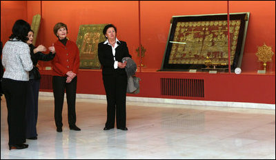 Mrs. Laura Bush listens to Ms. Roxana Theodorescu, Director of the National Art Museum, during a visit Thursday, April 3, 2008, in Bucharest.