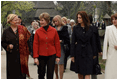 Mrs. Laura Bush walks with the spouses of NATO leaders Thursday, April 3, 2008, at the open-aired Dimitrie Gusti Village Museum in Bucharest. With her are Maria Basescu, right, spouse of Romania's President Traian Basescu, and Alexandra Coman, fiance of Romania's Foreign Minister Adrian Cioroianu. White House photo by Shealah Craighead
