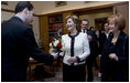 Mrs. Laura Bush accepts a bouquet of flowers as she arrives for tea Friday, April 4, 2008, with Mrs. Milka Mesic, right, spouse of Croatian President Stjepan Mesic, at the Office of the President in Zagreb.