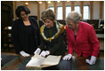 Mrs. Laura Bush is shown a rare book during her visit Saturday, April 5, 2008, to the Croatian State Archives in Zagreb.