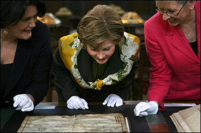 Mrs. Laura Bush is shown an ancient map during her visit Saturday, April 5, 2008, to the Croatian State Archives in Zagreb.