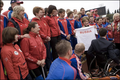 Mrs. Laura Bush holds a T-shirt presented to her Sunday, April 6, 2008, by members of the Russian Paralympic team at Central Sochi Stadium in Sochi, Russia.