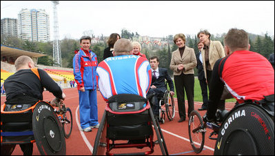 Mrs. Laura Bush visits with members of the Russian Paralympic Team Sunday, April 6, 2008, during a visit to Central Sochi Stadium in Sochi, Russia.