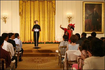 Mrs. Laura Bush welcomes Salma Kikwete, First Lady of Tanzania, during her remarks before a performance from Ford Theatre's new production, One Destiny, Monday, April 7, 2008, in the East Room of the White House.
