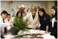 Mrs. Laura Bush works with students from the Williams Preparatory School in Dallas, Thursday, April 10, 2008, during planting events at the First Bloom program to help encourage youth to get involved with conserving America's National Parks.