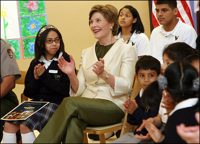 Mrs. Laura Bush applauds program speakers as she joins students from the Williams Preparatory School in Dallas, Thursday, April 10, 2008, during events at the First Bloom program to help encourage youth to get involved with conserving America's National Parks. Through the First Bloom program, the National Park Foundation and the National Park Services are joining with the Lady Bird Johnson Woldflower Center and community groups to connect young people to our national parks.