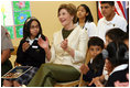 Mrs. Laura Bush applauds program speakers as she joins students from the Williams Preparatory School in Dallas, Thursday, April 10, 2008, during events at the First Bloom program to help encourage youth to get involved with conserving America's National Parks. Through the First Bloom program, the National Park Foundation and the National Park Services are joining with the Lady Bird Johnson Woldflower Center and community groups to connect young people to our national parks.
