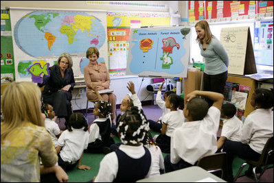 Mrs. Laura Bush is joined by U.S. Education Secretary Margaret Spellings as she visits the first grade classroom and students of teacher Laura Gilbertson, right, Monday, April 14, 2008, at the Martin Luther King Elementary School in Washington, D.C., to mark the tenth anniversary of Teach for America Week.