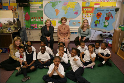 Mrs. Laura Bush, her daughter Jenna Bush, left, and U.S. Education Secretary Margaret Spellings pose for a photo with the first grade students of teacher Laura Gilbertson, right, Monday, April 14, 2008, at the Martin Luther King Elementary School in Washington, D.C., to mark the tenth anniversary of Teach for America Week.