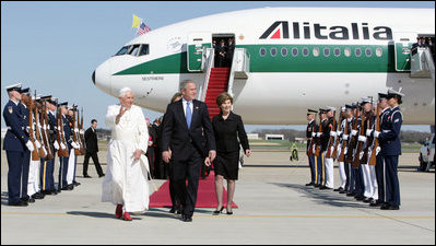 President George W. Bush walks the red carpet with Pope Benedict XVI upon the Pontiff's arrival Tuesday, April 15, 2008, at Andrews Air Force Base, Maryland. Mrs. Laura Bush and daughter Jenna also were on hand to accompany welcome the Pope.