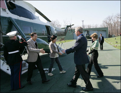 President George W. Bush and Laura Bush welcome South Korean President Lee Myung-bak and his wife, Kim Yoon-ok, Friday, April 18, 2008, to the Presidential retreat at Camp David, Md.