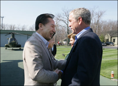 President George W. Bush and Laura Bush welcome South Korean President Lee Myung-bak and his wife, Kim Yoon-ok, Friday, April 18, 2008, to the Presidential retreat at Camp David, Md.