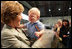 Mrs. Laura Bush receives a smile from a young boy as she greets the audience Monday, Aug. 4, 2008, after remarks by the President at Eielson Air Force Base, Alaska, their first stop en route to Asia.