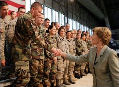 Mrs. Laura Bush shakes hands with military personnel Monday, Aug. 4, 2008, following remarks by President George W. Bush during their stop at Eielson Air Force Base, Alaska.