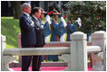 President George W. Bush and President Myung-bak Lee of the Republic of Korea, pause for their respective national anthems Wednesday, Aug. 6, 2008, during arrival ceremonies for President Bush and Mrs. Laura Bush in Seoul.