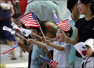 Children wave American and South Korean flags during the visit of President George W. Bush and Mrs. Laura Bush Wednesday, August 6, 2008, to Seoul. 