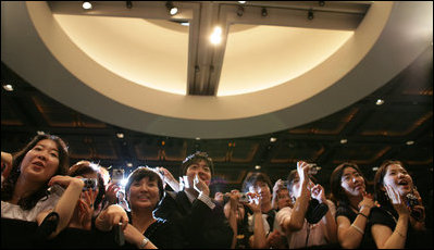 Crowds in Seoul at the United States Embassy eagerly respond to President George W. Bush and Mrs. Laura Bush on August 6, 2008. 