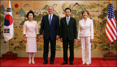 President George W. Bush and Mrs. Laura Bush are seen with South Korean President Lee Myung-bak and first lady Yoon-ok Kim during arrival ceremonies Wednesday, Aug. 6, 2008, at the Blue House presidential residence in Seoul, South Korea.