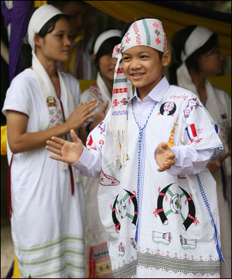 Residents of the Mae La Refugee Camp at Mae Sot, Thailand, perform traditional dance for Mrs. Laura Bush during her visit to the camp on the Burma border on Aug. 7, 2008. It has been almost 20 years since the August 8, 1988 crackdown in Burma which began forcing residents from the country. Many of the people in the Mae La Refugee Camp and the other eight camps along the border have been born in the camps or lived most of their lives in the camps, waiting for conditions to improve in Burma or to move to the United States and other countries.