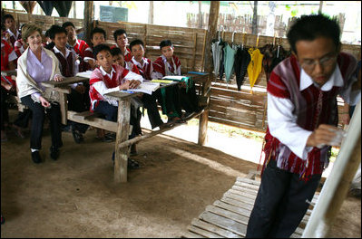 Mrs. Laura Bush sits in on a grammar class during her visit on Aug. 7, 2008 to the Mae La Refugee Camp at Mae Sot, Thailand. The camp, the largest of nine in Thailand, houses at least 39,000 Burmese refugees, many of whom home to resettle in the United States if conditions do not permit them to return to their home country.