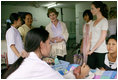 Mrs. Laura Bush and daughter Barbara Bush talk with a nurse Thursday, Aug. 7, 2008 at Mae Tao Clinic at the Mea La Refugee Camp which provides free treatment for the sick and wounded Burmese migrant workers in Mae Sot, Thailand. 