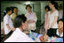 Mrs. Laura Bush and daughter Barbara Bush talk with a nurse Thursday, Aug. 7, 2008 at Mae Tao Clinic at the Mea La Refugee Camp which provides free treatment for the sick and wounded Burmese migrant workers in Mae Sot, Thailand. 