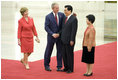 President George W. Bush and Mrs. Laura Bush are greeted by Chinese President Hu Jintao and Madam Liu Yongqing at the Great Hall of the People in Beijing Friday, Aug. 8, 2008, for the social lunch in honor of the 2008 Summer Olympic Games.