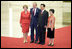 President George W. Bush and Mrs. Laura Bush participate in a photo opportunity with President Hu Jintao of the People's Republic of China and Madam Liu Yongqing at the social luncheon in honor of the 2008 Summer Olympic Games in Beijing. The luncheon was held at the Great Hall of the People.