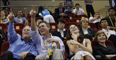 President George W. Bush is joined by his brother, Marvin Bush, daughter, Ms. Barbara Bush and Mrs. Laura Bush as they attend the U.S. Women's Olympic Basketball Team's match Saturday, Aug. 9, 2008, against the Czech Republic team at the Beijing 2008 Summer Olympics Games.